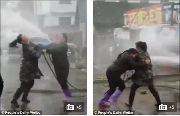 LOL?? Car Wash Owners Fight In Public In An Attempt To Win The Same Customers (Photos)